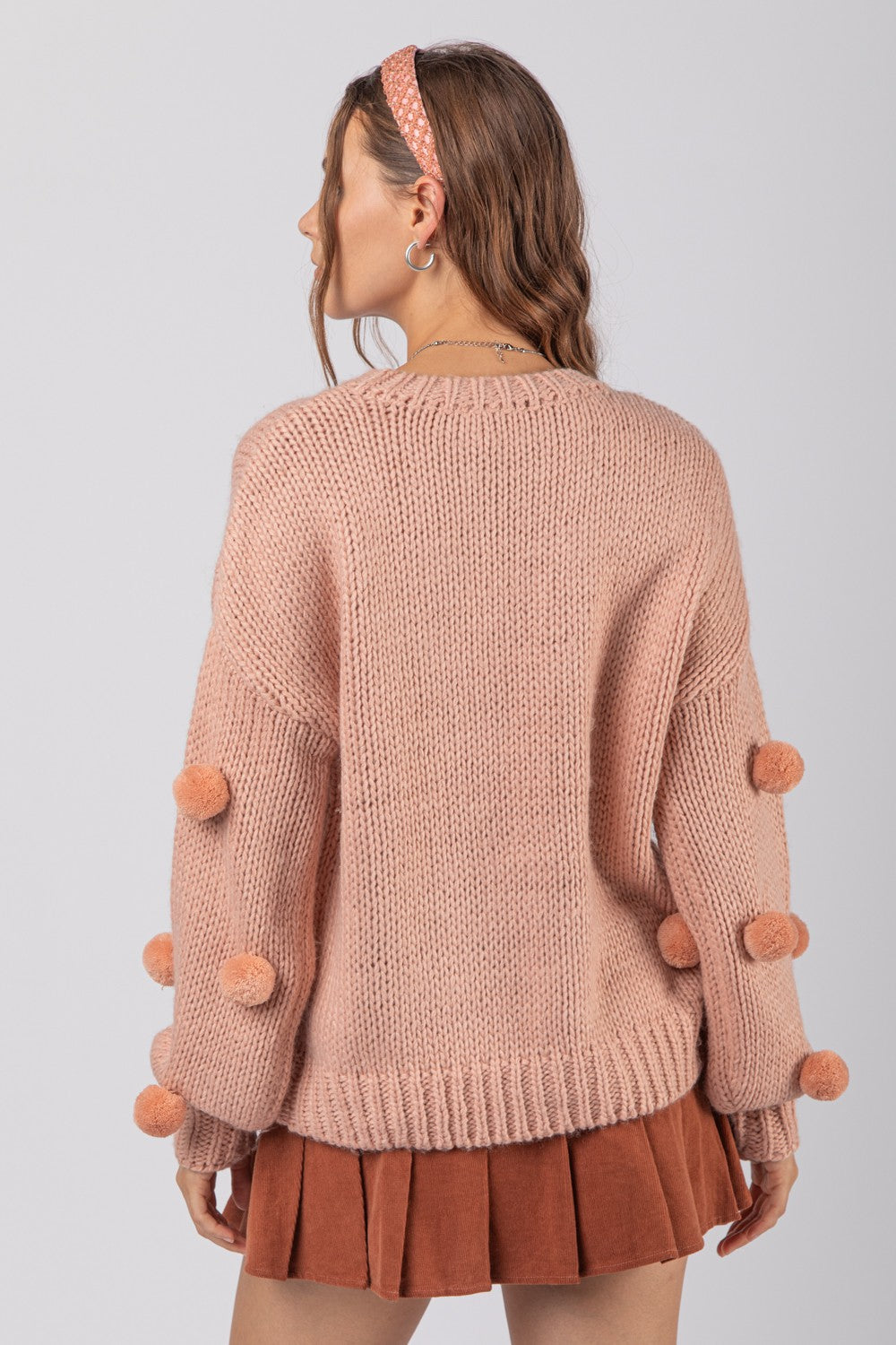 Sweater with on sale puff balls